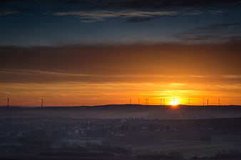 Sunrise Over Wind Turbines in German Countryside