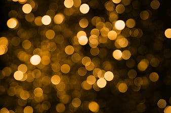 Golden Bokeh Lights Background with Warm Glowing Orbs