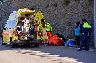 Emergency responders and police at roadside accident scene