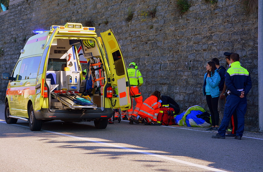 Emergency responders and police at roadside accident scene