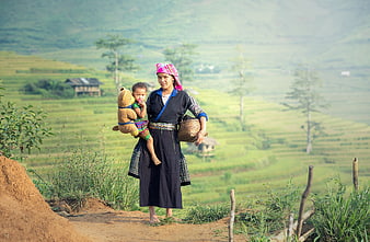 Hmong Mother and Child in Traditional Attire on Rice Terraces