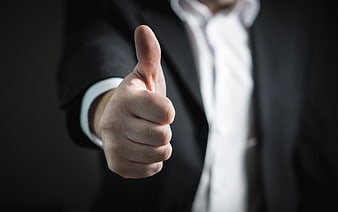 Businessman Giving Thumbs Up Gesture in Suit