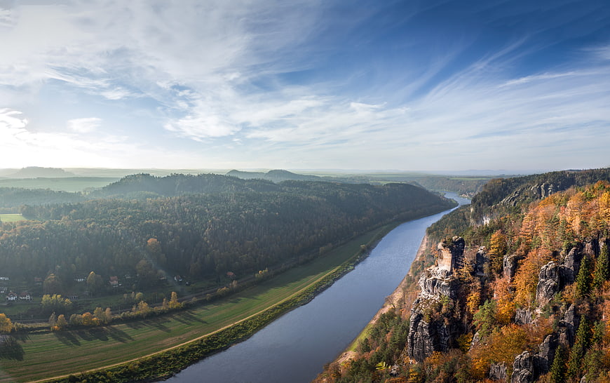 Aerial View of River Valley with Autumn Forest and Rock Formations