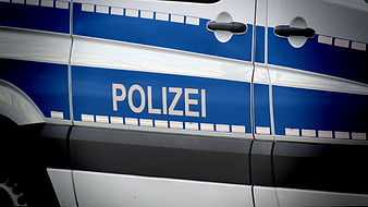 Close-up of German Police Car Side Panel with Blue Livery