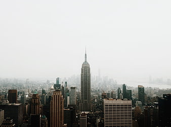 Empire State Building in Foggy New York City Skyline