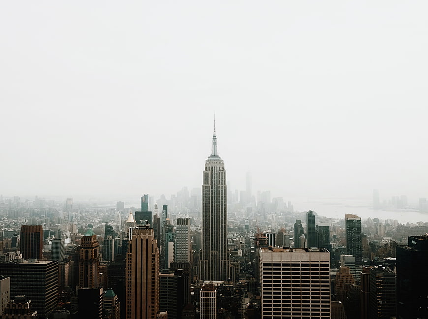 Empire State Building in Foggy New York City Skyline