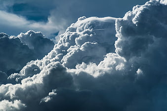 Dramatic Cumulonimbus Clouds Against Blue Sky
