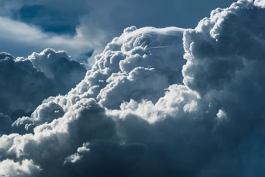 Dramatic Cumulonimbus Clouds Against Blue Sky