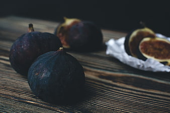 Fresh ripe figs on rustic wooden table
