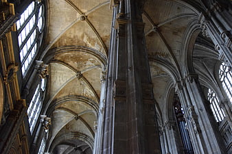Gothic Cathedral Interior with Vaulted Ceilings and Stone Pillars