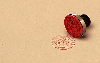 Red Top Secret Stamp on Brown Paper Background