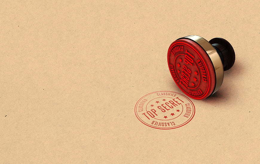 Red Top Secret Stamp on Brown Paper Background