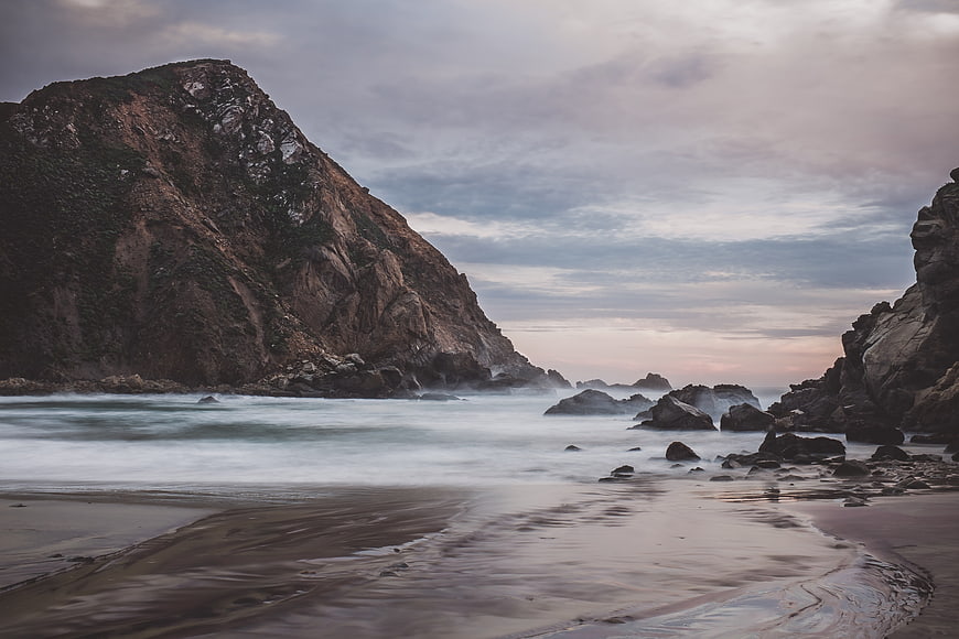 Dramatic Coastal Landscape with Long Exposure Ocean and Rocky Cliffs