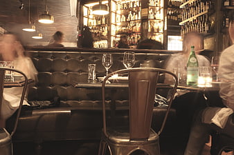 Motion blur interior of a busy restaurant with leather booths