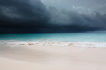 Dramatic Dark Storm Clouds Over Turquoise Tropical Beach