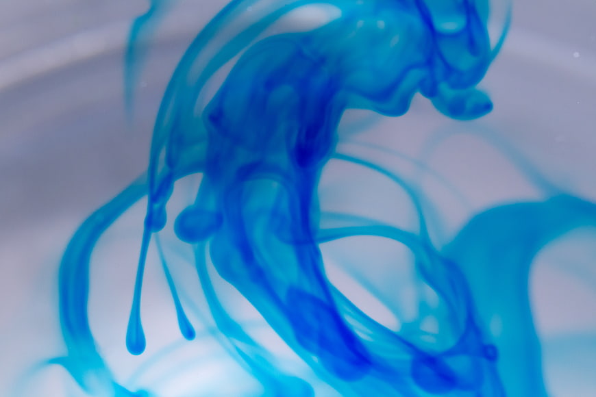 Abstract Blue Ink Swirling in Clear Water