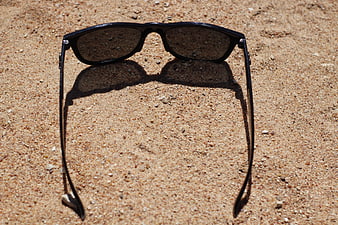 Black Sunglasses on Sand Beach Summer