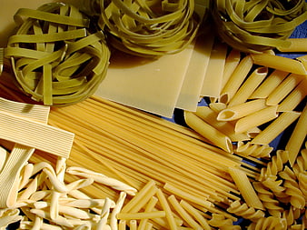 Assorted Raw Pasta Shapes Including Spaghetti, Penne, and Lasagna
