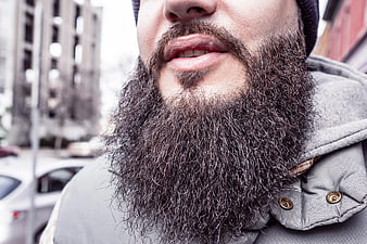 Close-up of man with thick beard and winter jacket
