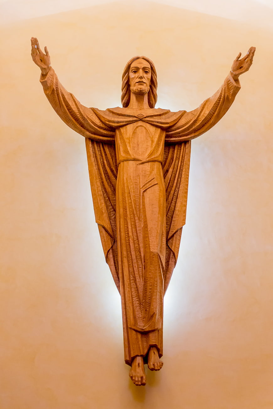 Wooden Sculpture of Risen Christ with Open Arms in Church