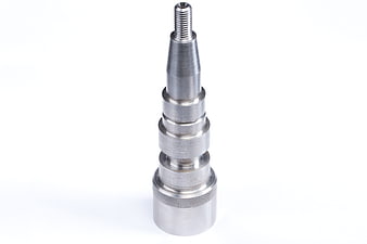 Precision machined metal shaft with threaded tip on white background