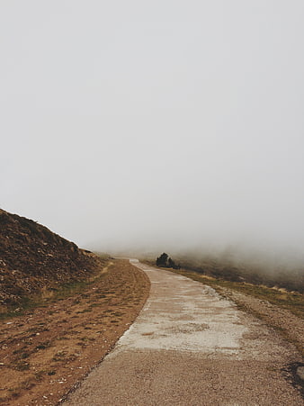 Foggy Mountain Road Disappearing into Mist