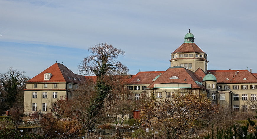 Historic Building with Red Roof and Green Dome in Munich
