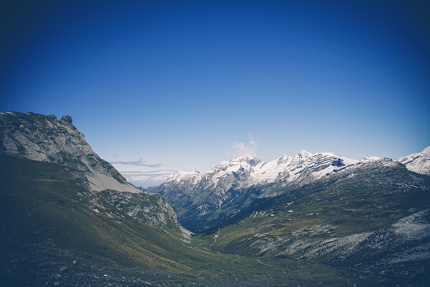 Majestic Snow-Capped Mountain Range with Green Valley