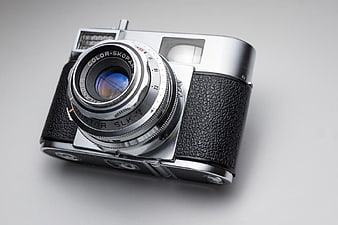 Vintage Silver Rangefinder Camera on White Background