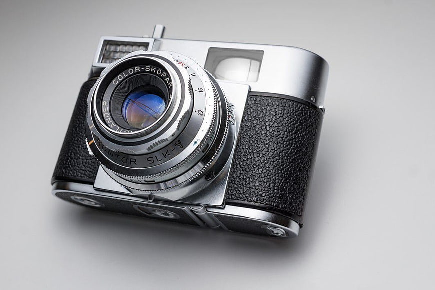 Vintage Silver Rangefinder Camera on White Background