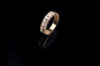 Gold Diamond Eternity Ring on Black Background