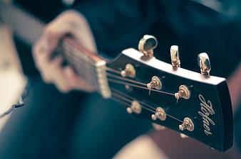 Close-up of Electric Guitar Headstock with Tuning Pegs