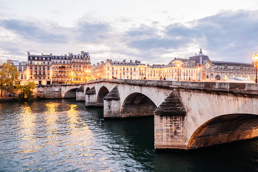 Pont au Change bridge over Seine river in Paris at dusk