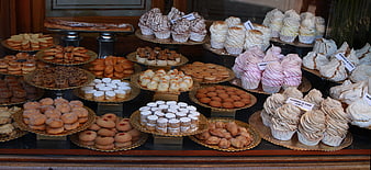 Assorted Pastries and Cupcakes in Bakery Shop Window Display
