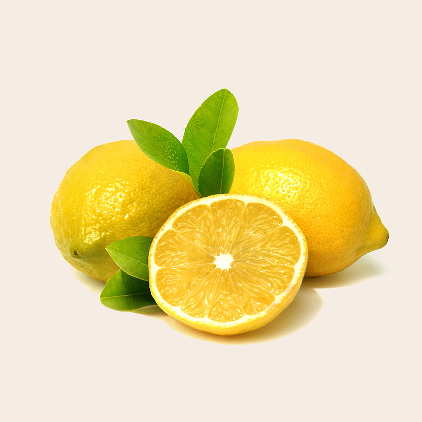Fresh Yellow Lemons with Green Leaves on White Background