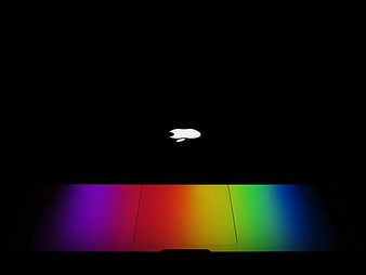 Glowing Apple Logo on Dark Background with Rainbow Light
