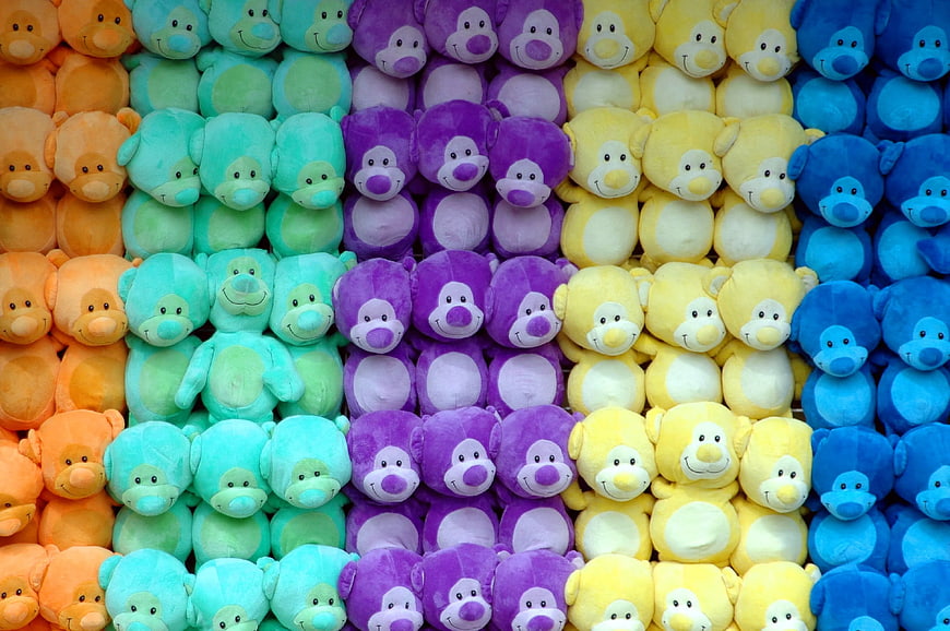 Colorful Rainbow Plush Monkey Toys Arranged in Rows