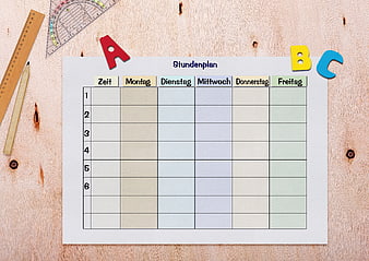 Empty German School Timetable Template on Wooden Desk