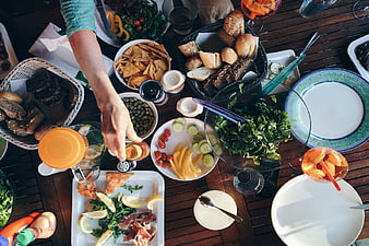 Overhead View of Summer Barbecue Feast on Wooden Table