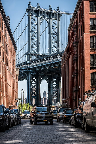 Manhattan Bridge View Between Brick Buildings