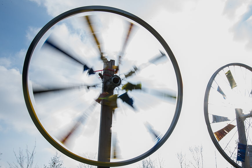 Spinning Prayer Wheels Against Blue Sky
