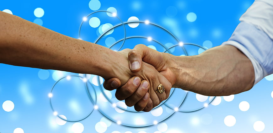Business Handshake Over Global Network Background
