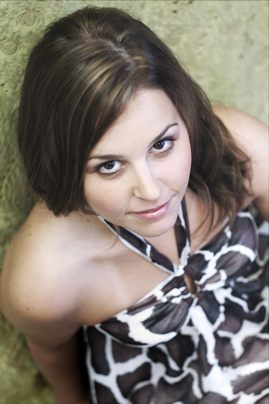 High angle portrait of young brunette woman looking up