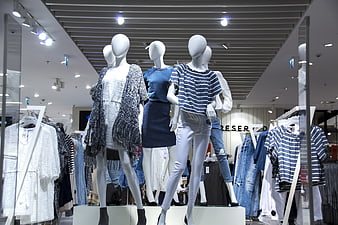 Fashion mannequins in clothing store window display