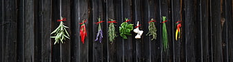 Fresh Herbs And Spices Hanging On Dark Rustic Wooden Fence