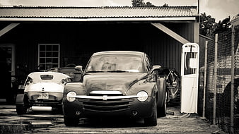 Vintage Chevrolet Corvette and Classic Car in Garage