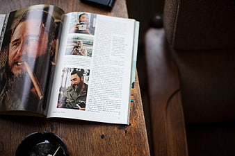 Open Magazine with Fidel Castro Article on Wooden Table