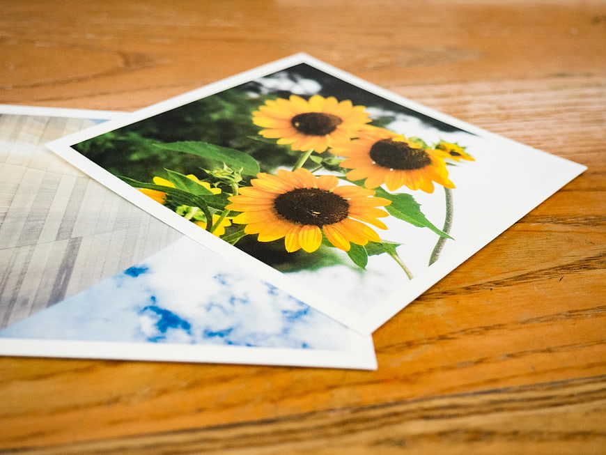 Printed Photos of Sunflowers on Wooden Table