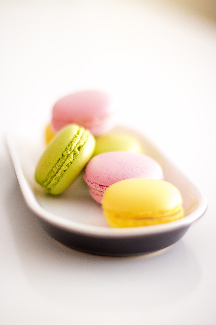 Colorful macarons on a white plate