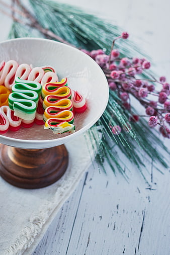 Colorful Ribbon Candy in White Bowl with Christmas Decor